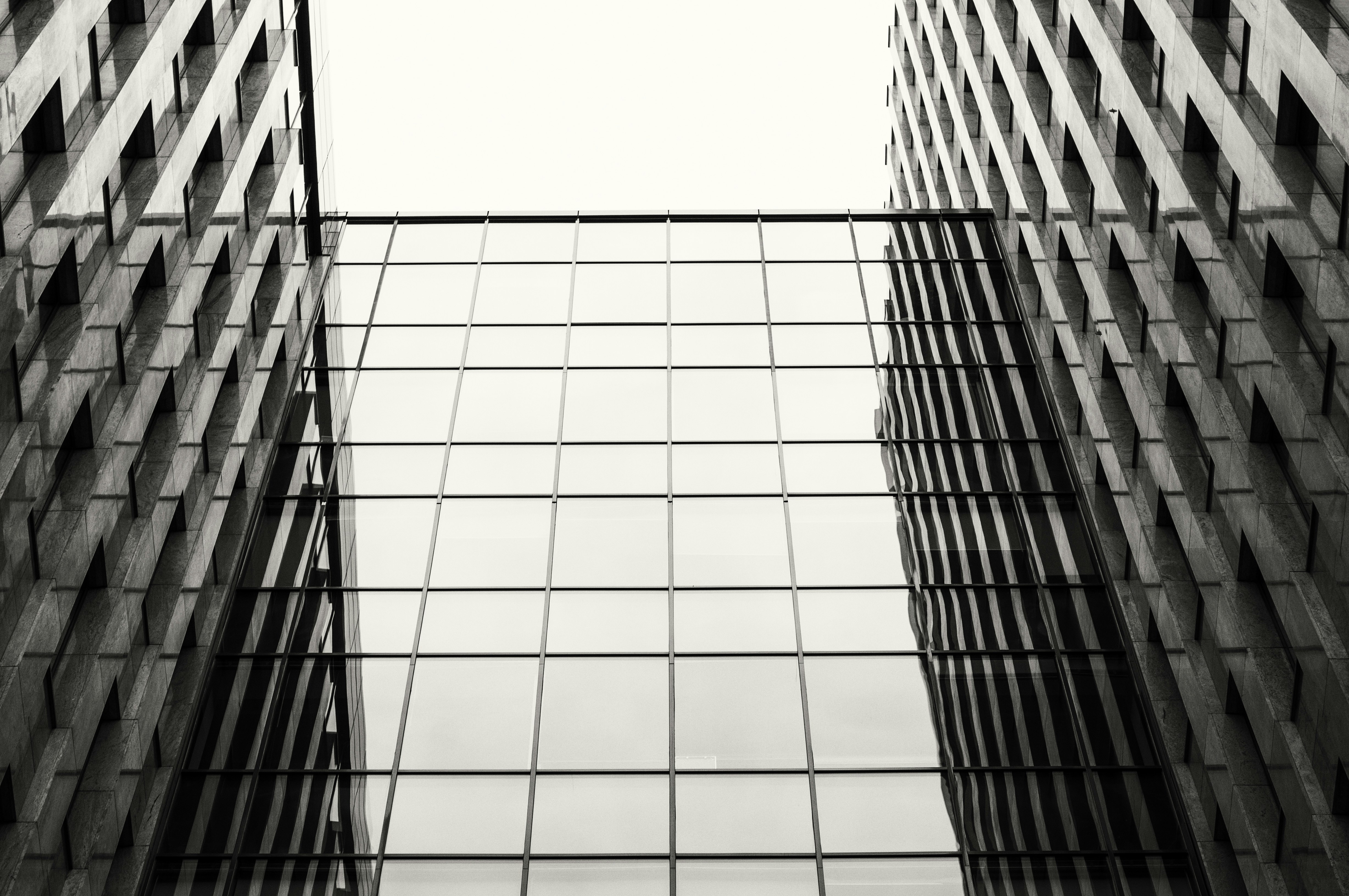 a black and white photo of two tall buildings