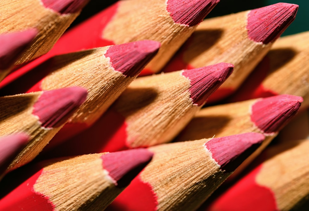 a close up of a group of red pencils