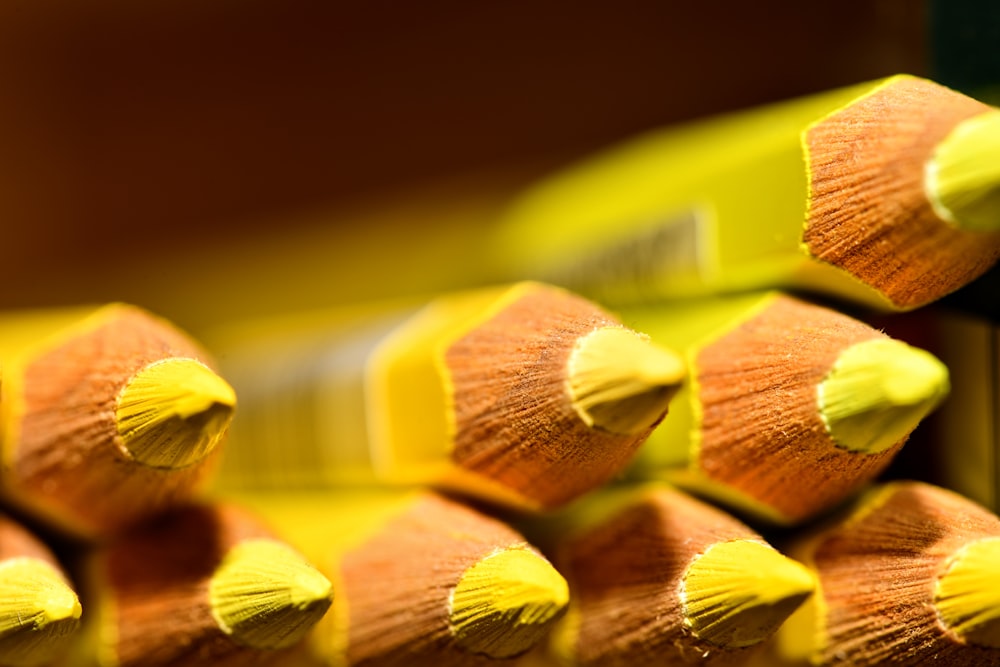 a close up of a group of yellow pencils