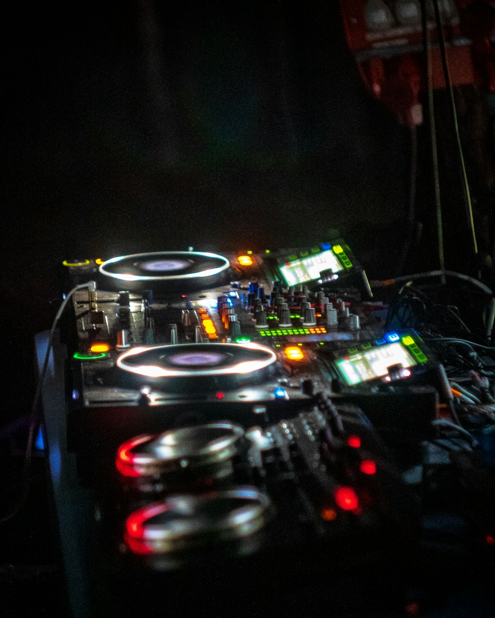 a dj's turntable in a dark room