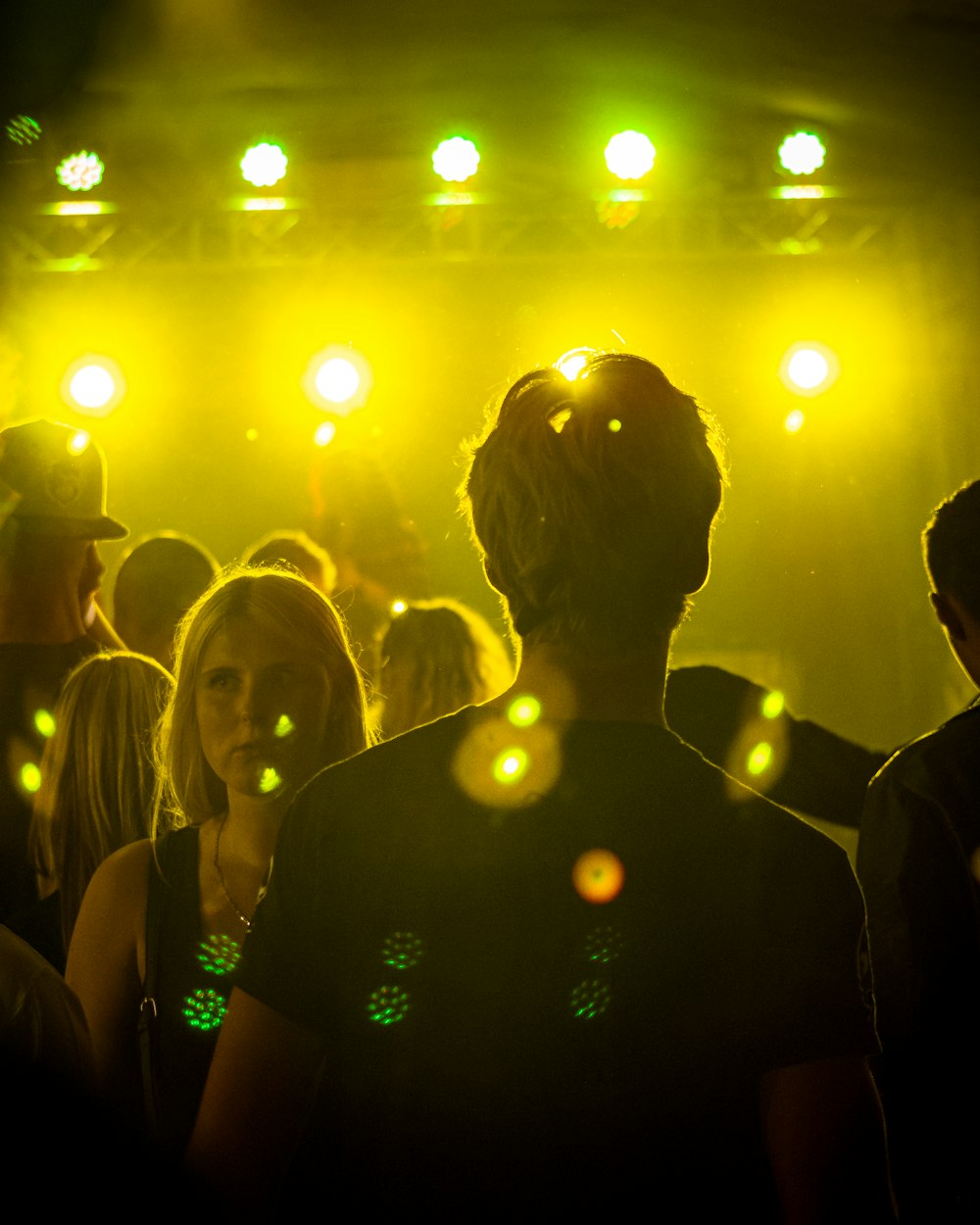 a group of people that are standing in the dark