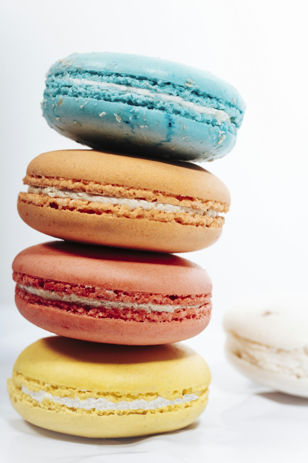 a stack of colorful macaroons sitting on top of each other