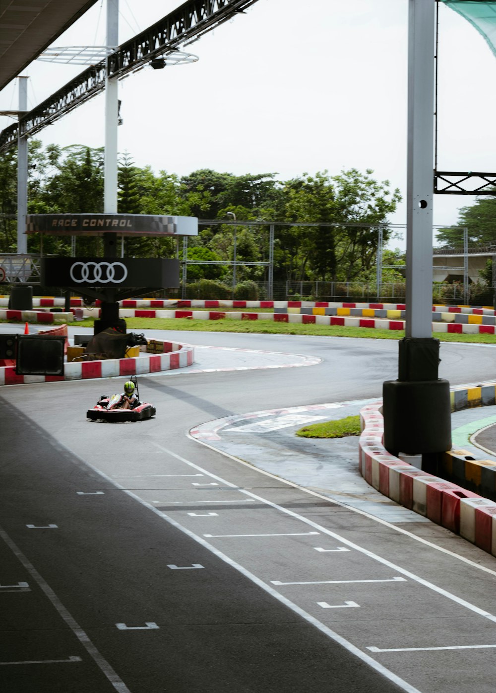 a man driving a car down a race track