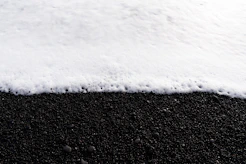 a black and white photo of snow on the ground