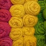a close up of a bunch of balls of yarn