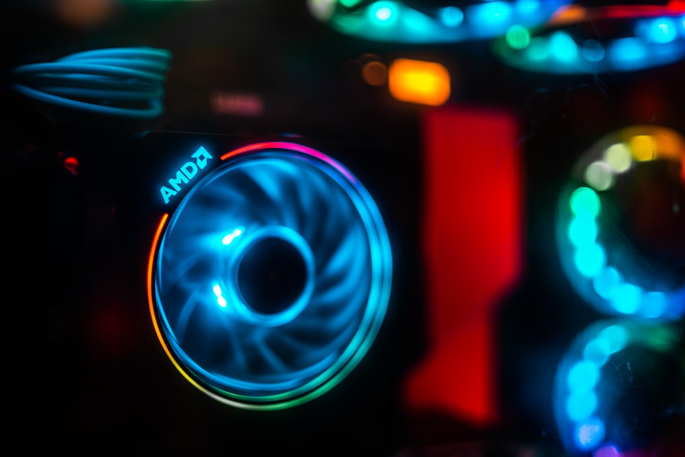 a close up of a speaker with lights in the background