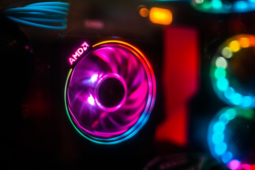 a close up of a colorful speaker in a dark room