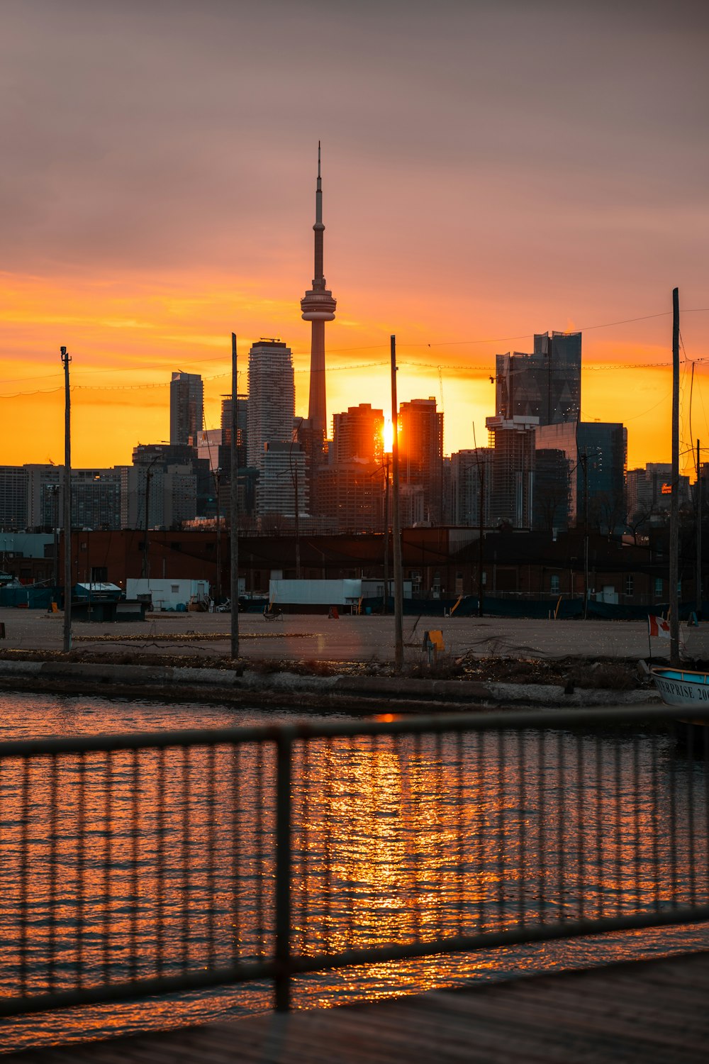 the sun is setting over the city skyline