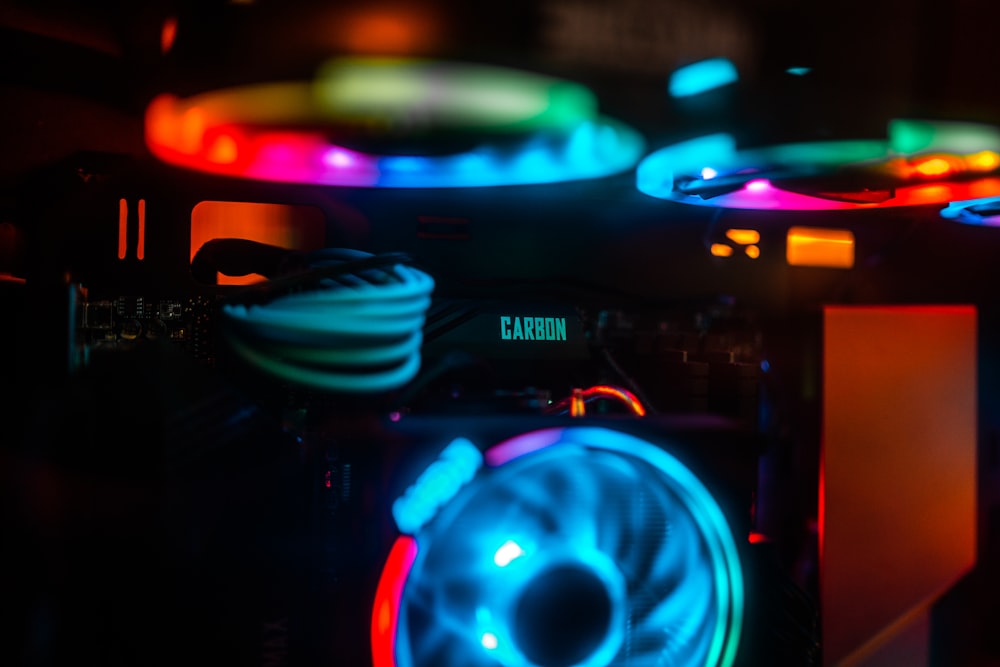 a close up of a speaker with a neon light on it