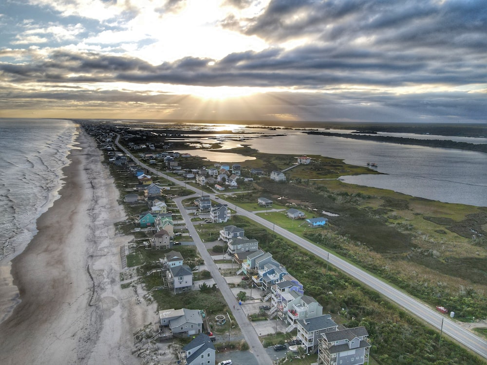 an aerial view of a beach with houses on it