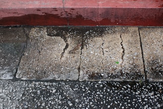 a dirty and stained concrete floor