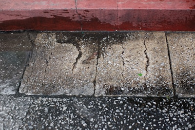 a dirty and stained concrete floor