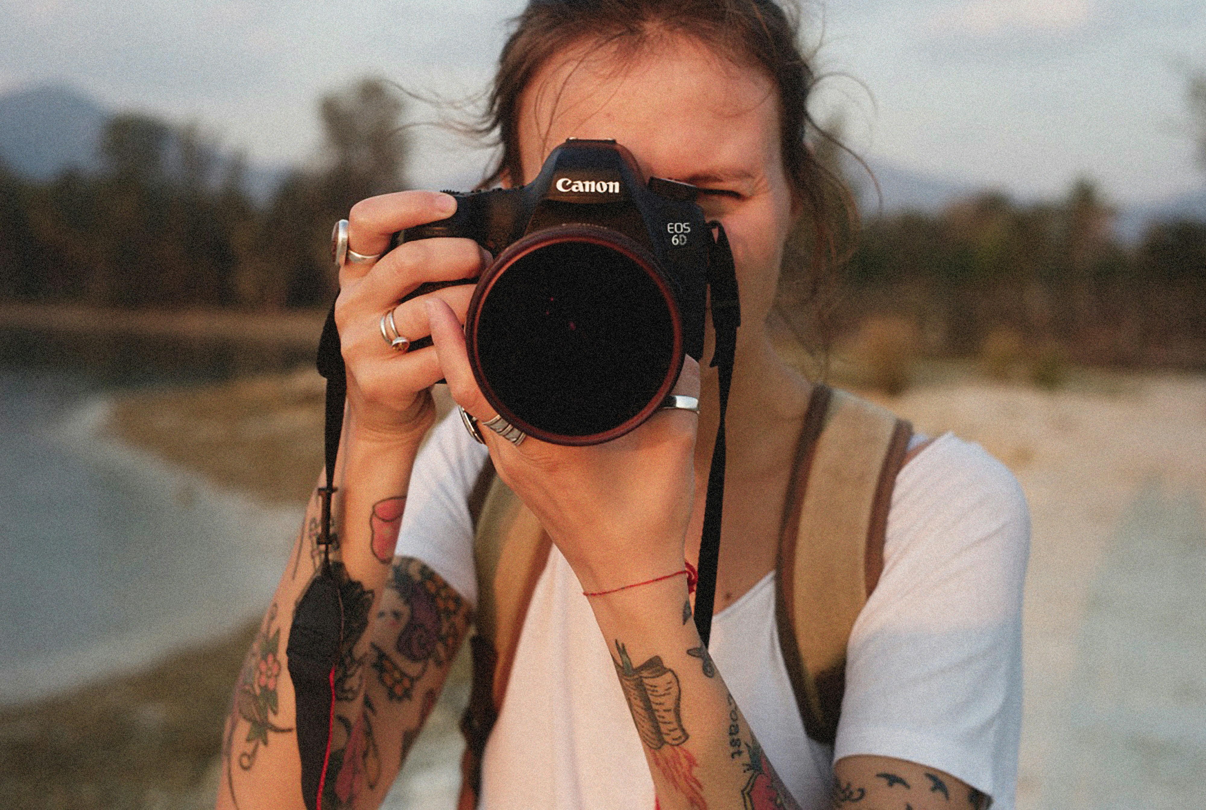 a woman taking a picture with a camera