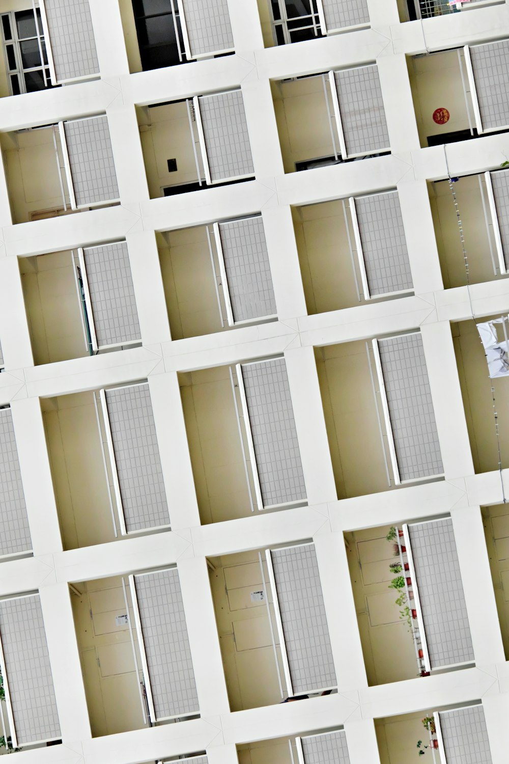 a tall white building with lots of windows