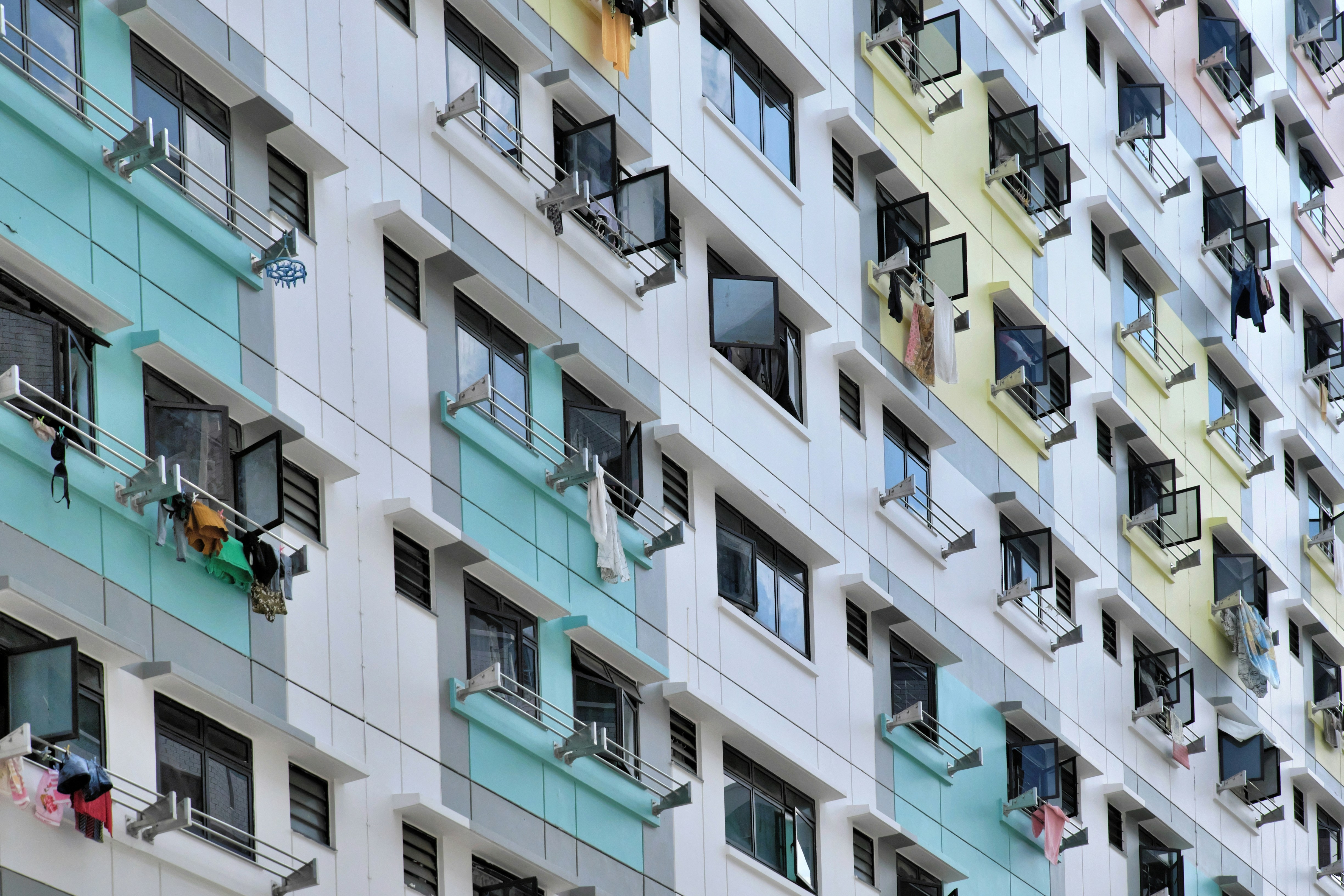 a multicolored building with clothes hanging out of the windows
