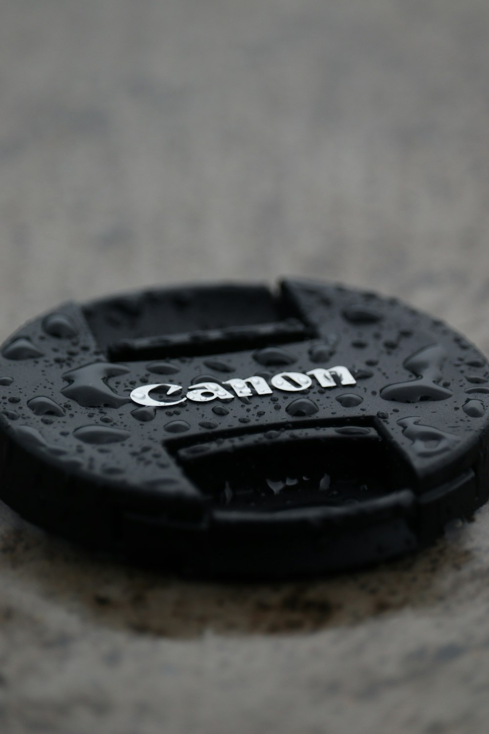 a camera lens cap sitting on top of a table