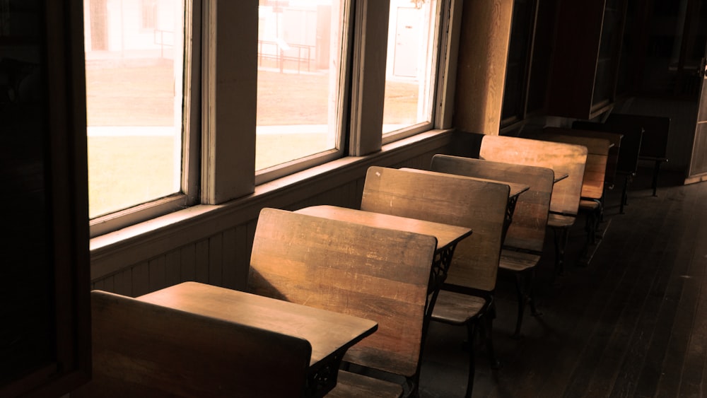 a row of chairs sitting in front of a window