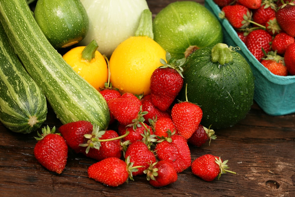 a bunch of fruits and vegetables sitting on a table