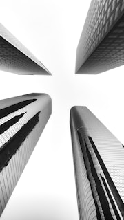 a black and white photo of tall buildings