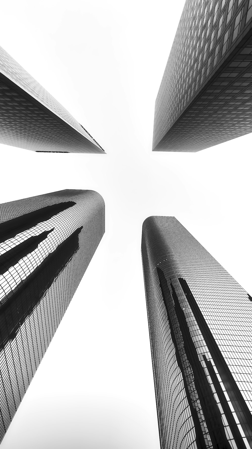 a black and white photo of tall buildings