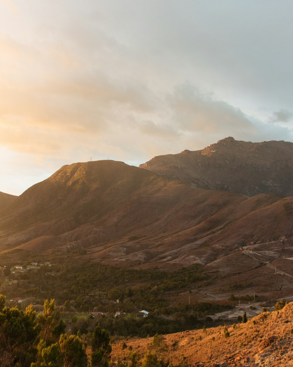 a view of a mountain range at sunset