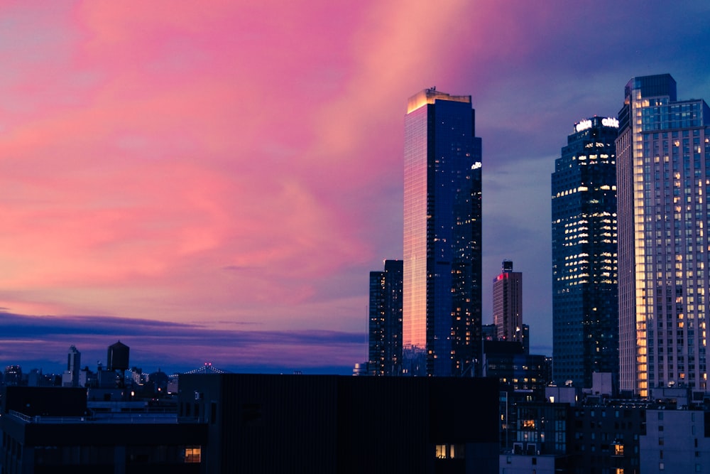 a view of a city skyline at dusk