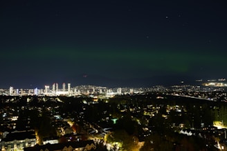 Night view of Sofia skyline with subtle aurora light effects.