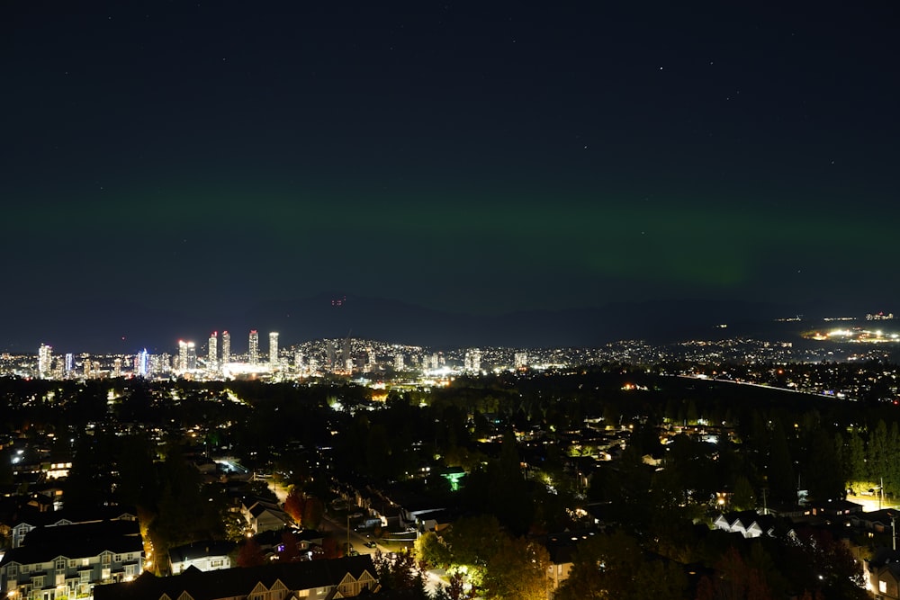 a view of a city at night with the lights on