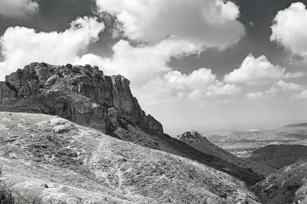 a black and white photo of a mountain range