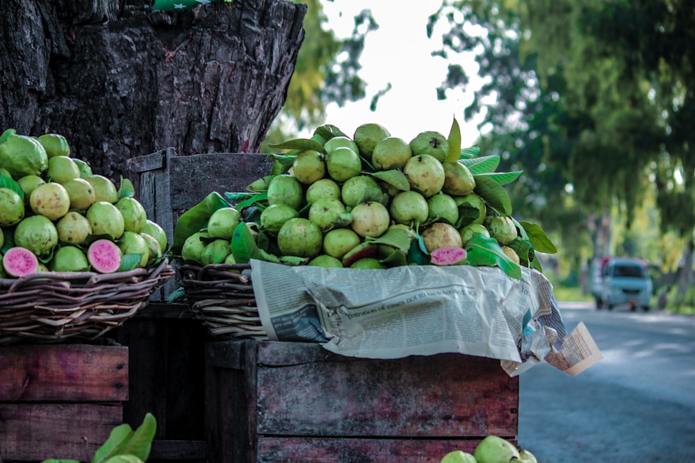 a pile of fruit sitting on top of a wooden crate