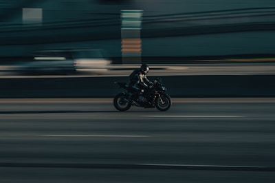 a person riding a motorcycle on a city street