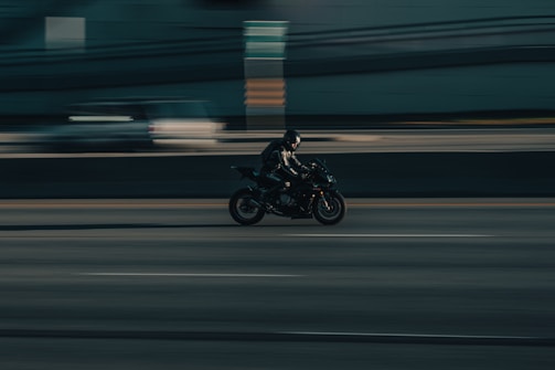 a person riding a motorcycle on a city street