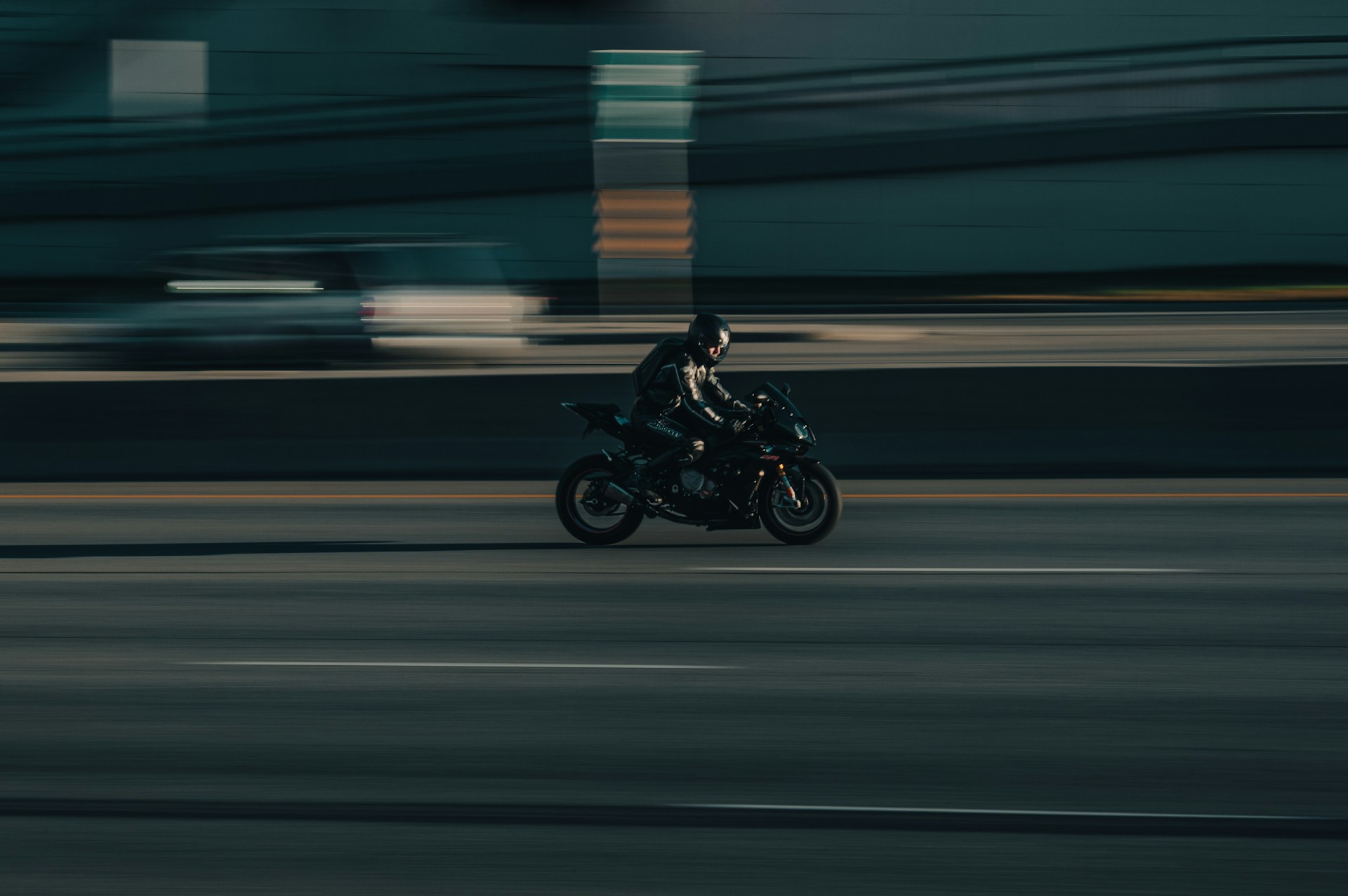 a person riding a motorcycle on a city street