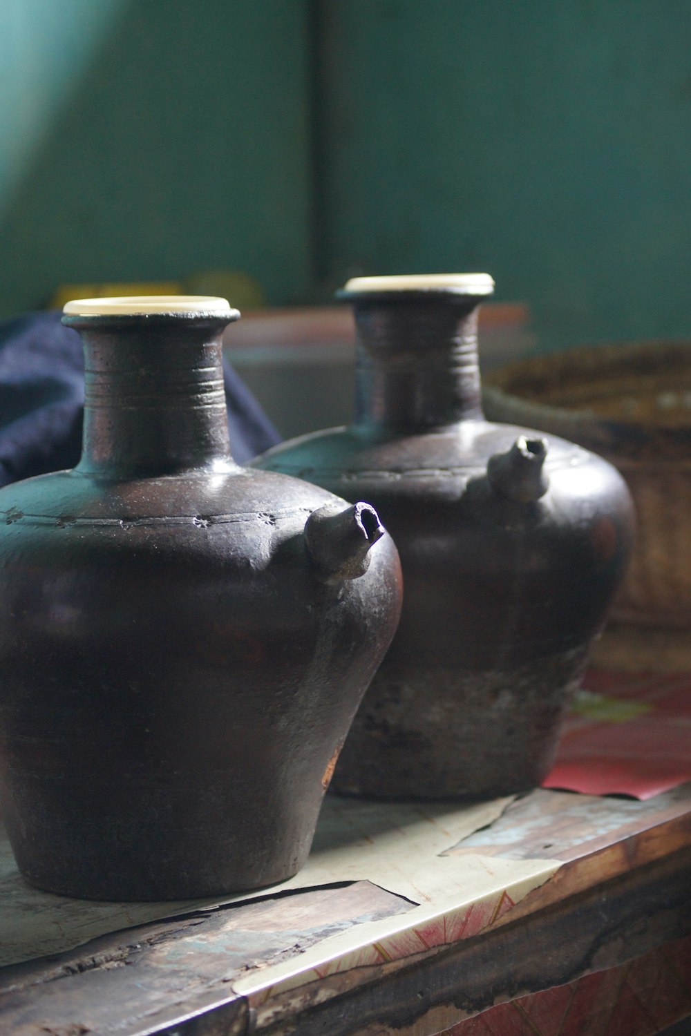 a couple of vases sitting on top of a table