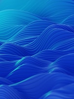 An abstract digital piece with flowing blue and green lines that evoke a gentle breeze.