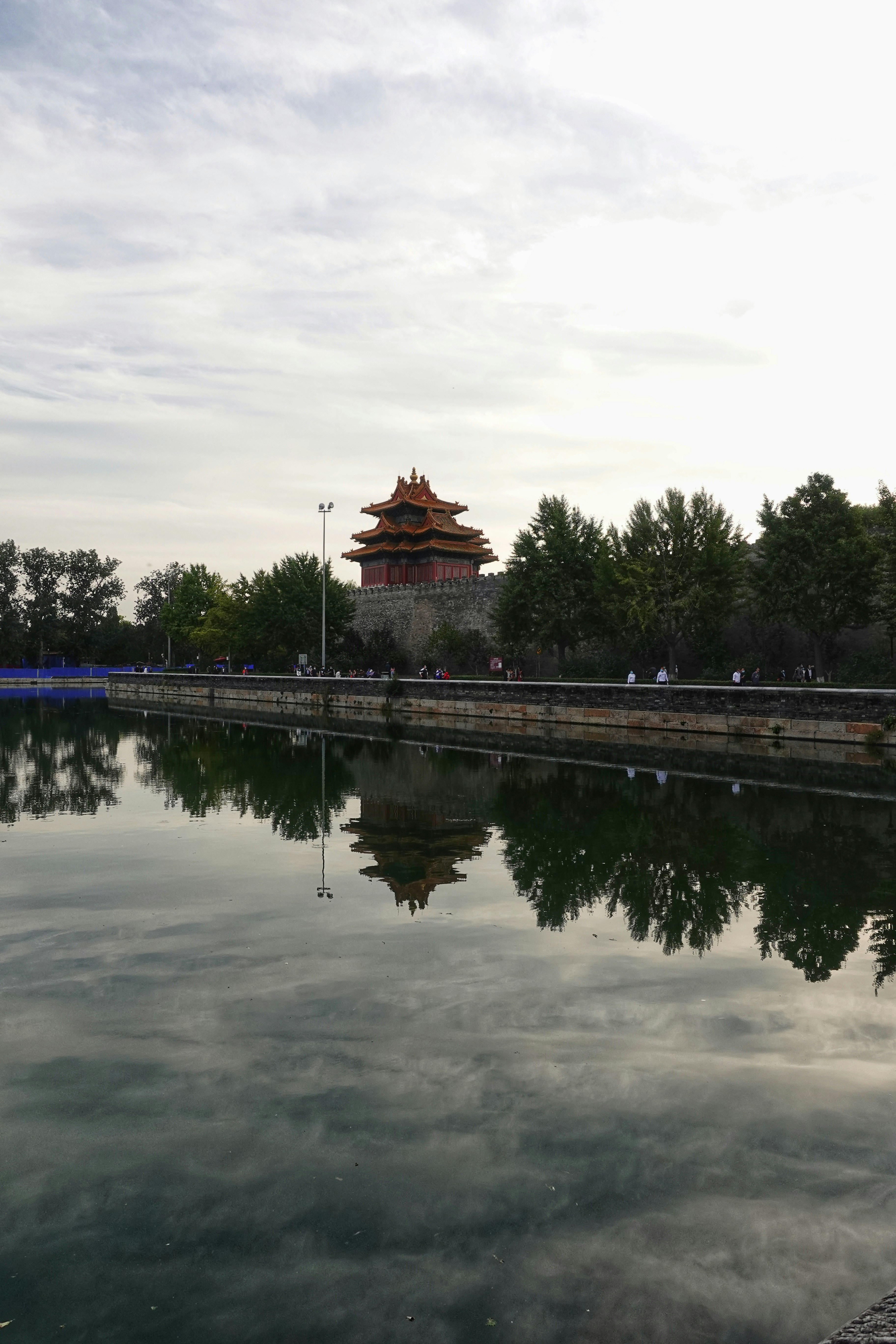 a body of water with a building in the background