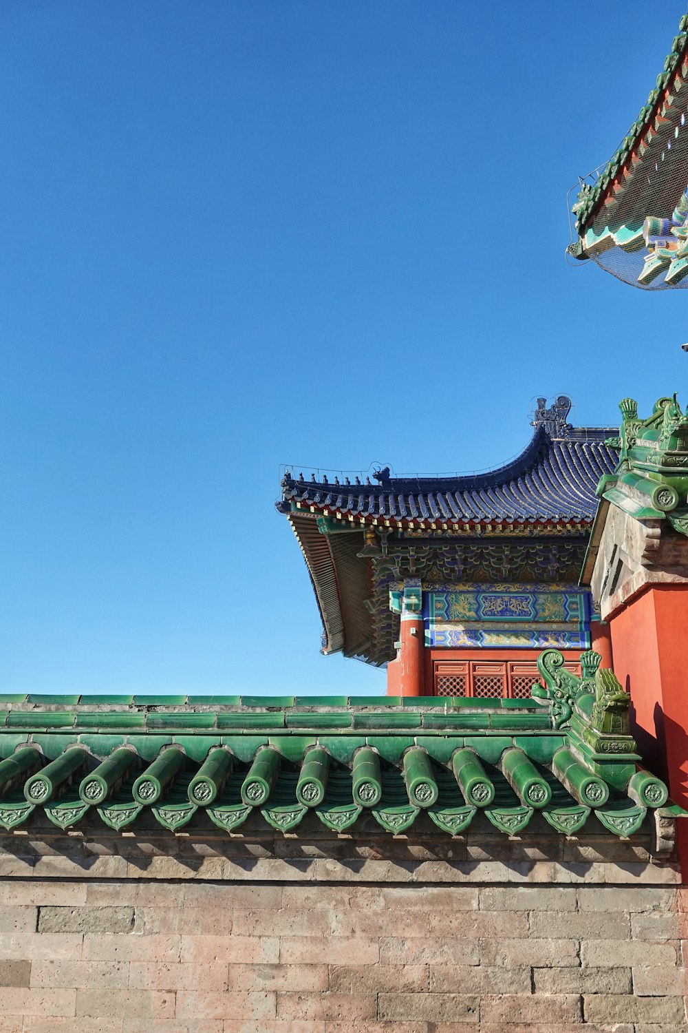 the roof of a building with a blue sky in the background