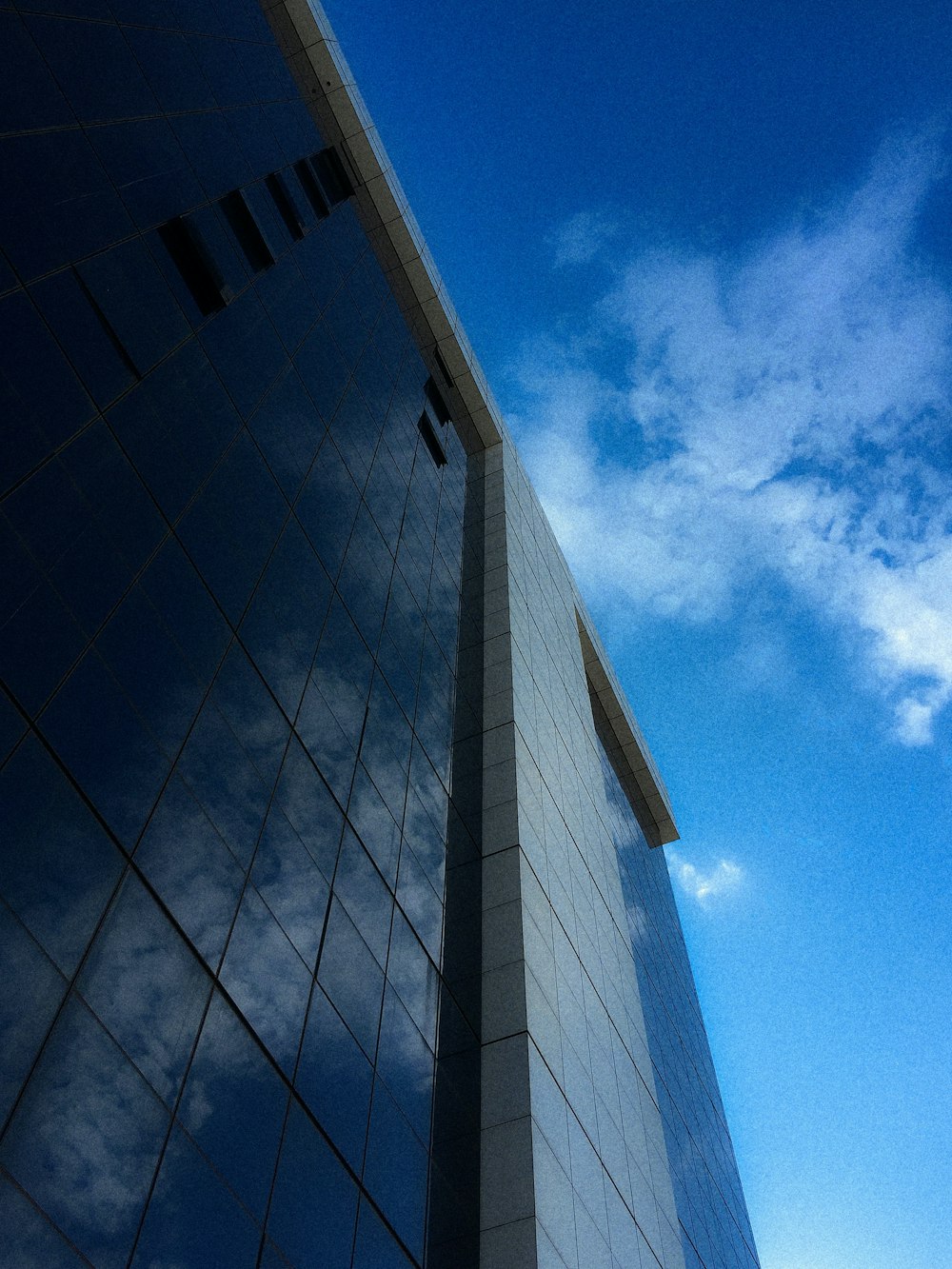 a very tall building with a sky in the background