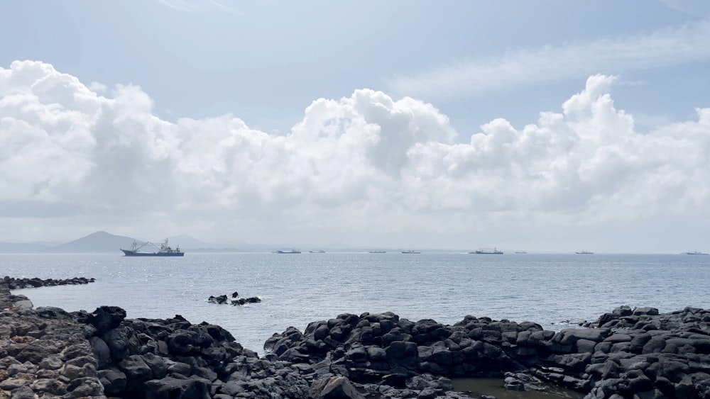 a boat is out in the ocean on a cloudy day