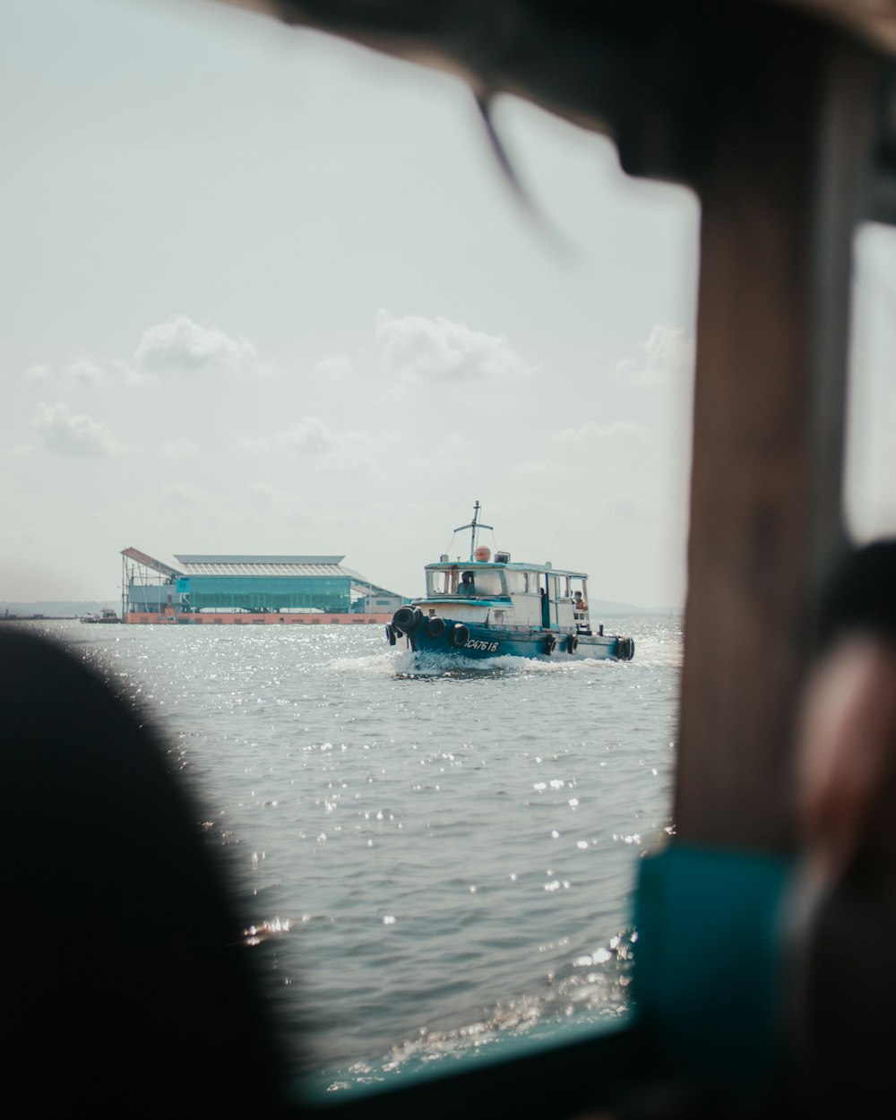 a small boat traveling across a large body of water