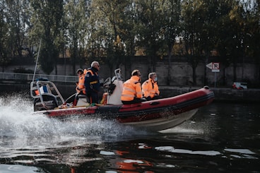 a group of people riding on the back of a boat