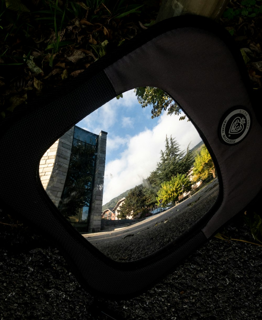 a view of a building through a mirror