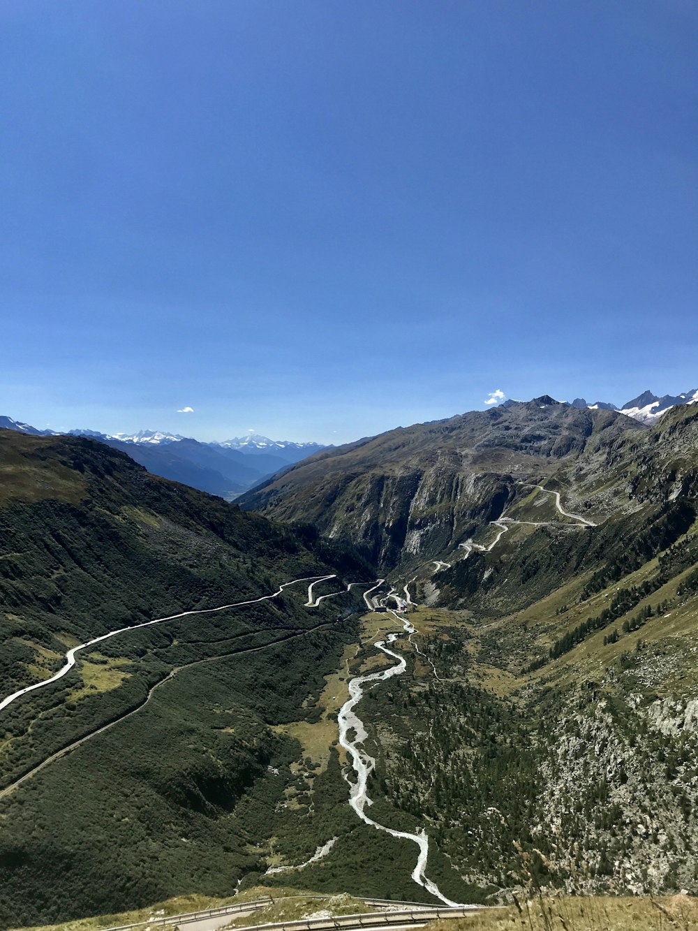 a view of a winding road in the mountains