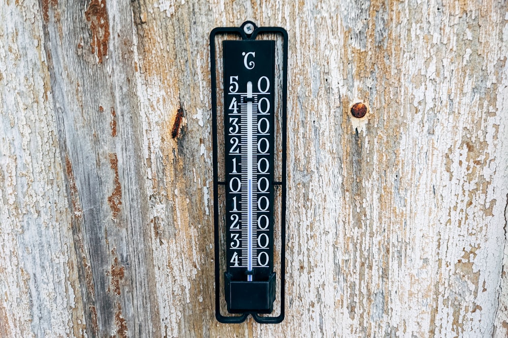 a door handle on a wooden door with numbers on it