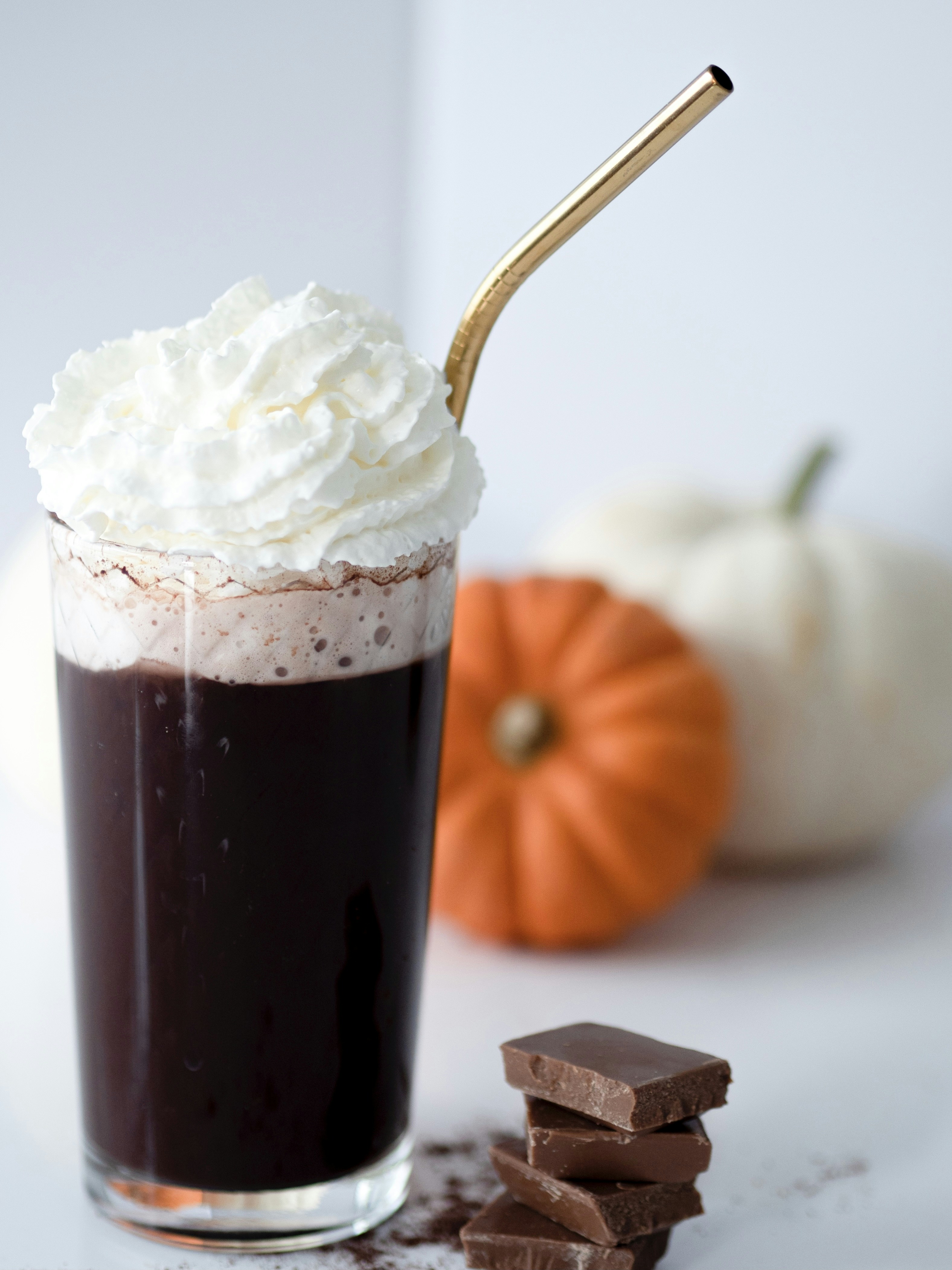 a cup of chocolate with whipped cream on top