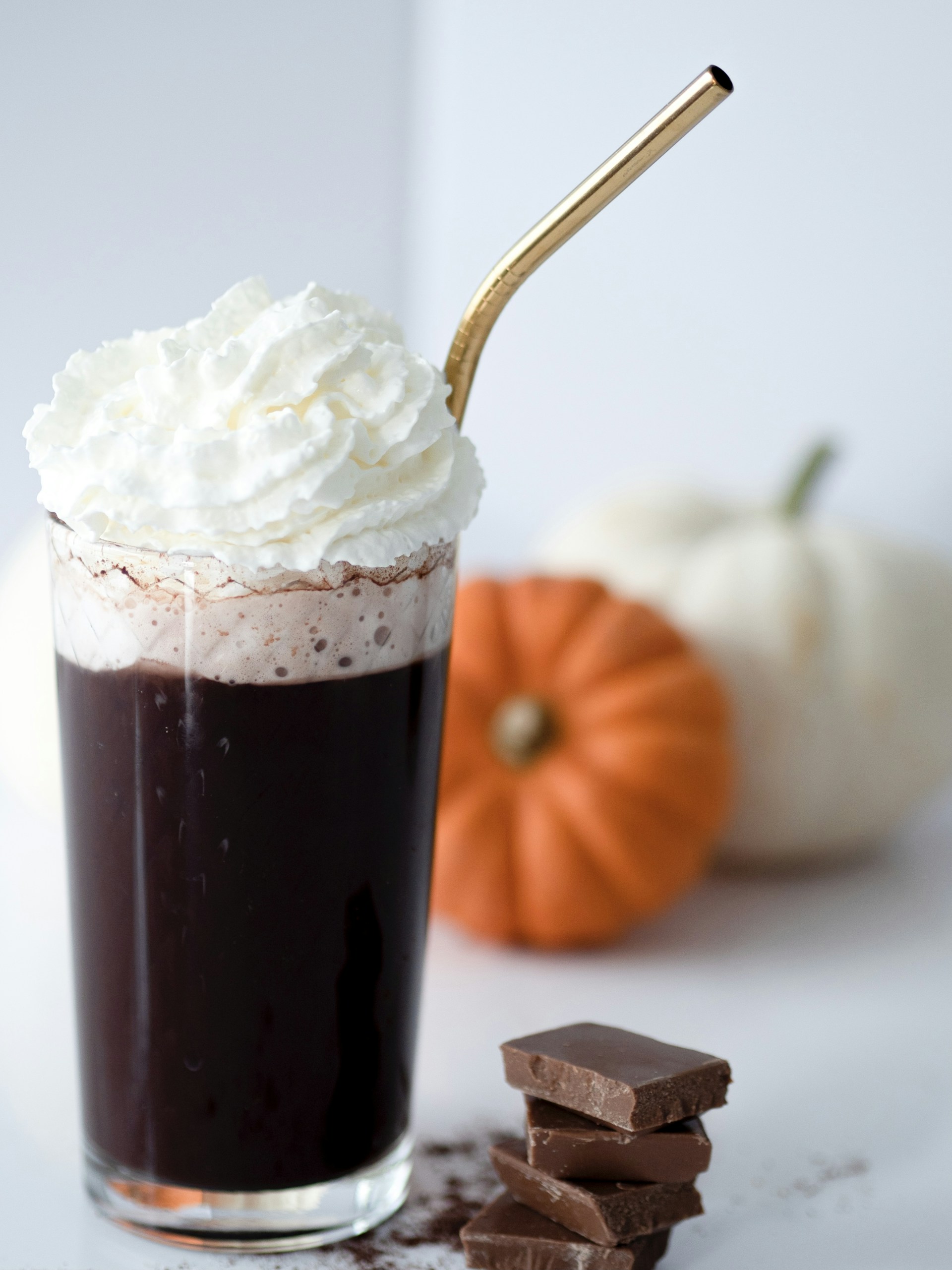 a cup of chocolate with whipped cream on top