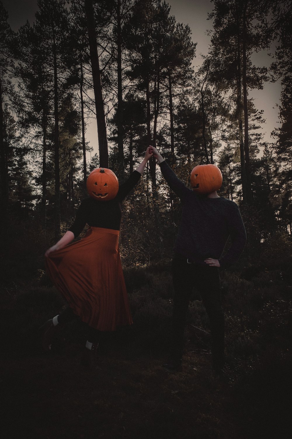 a couple of people that are standing in the woods