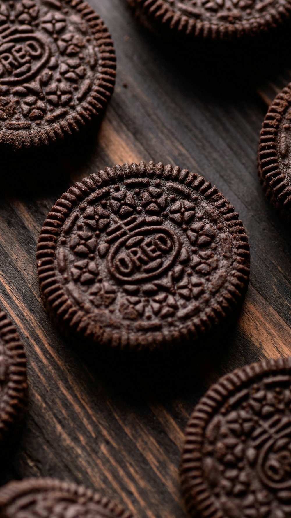 a close up of chocolate cookies on a wooden surface