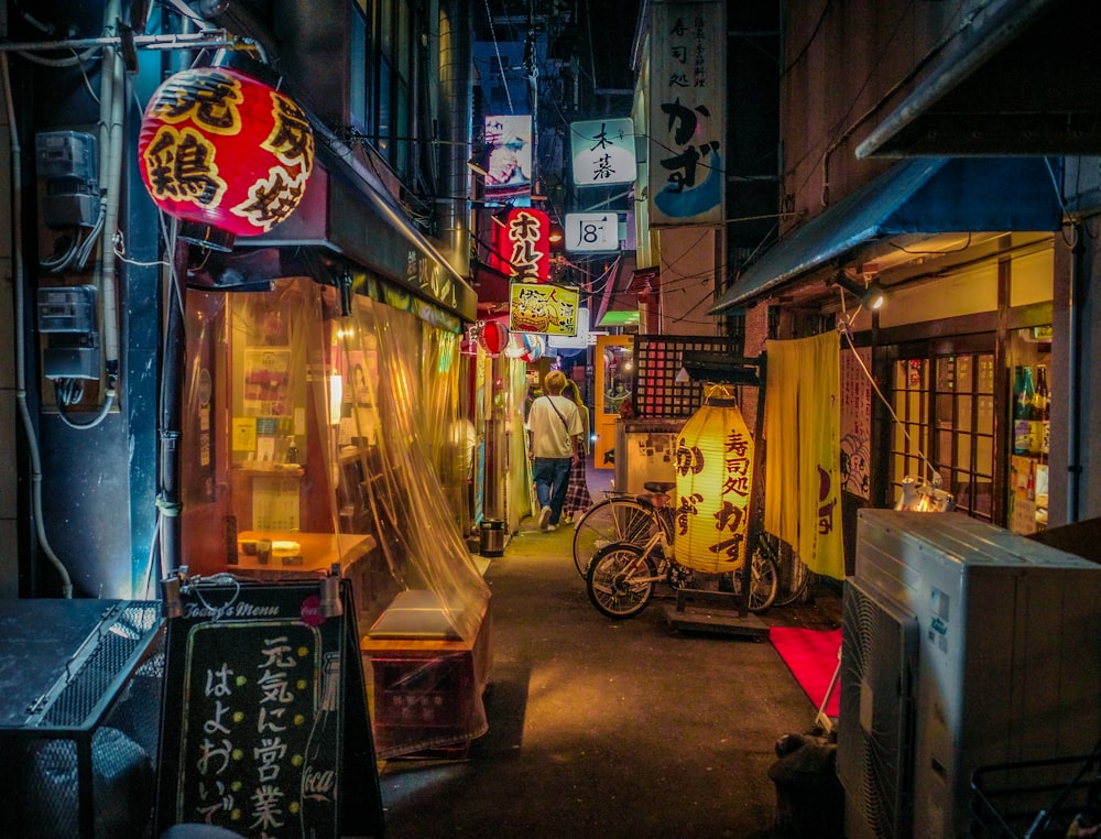 a narrow alley with a scooter parked in front of it