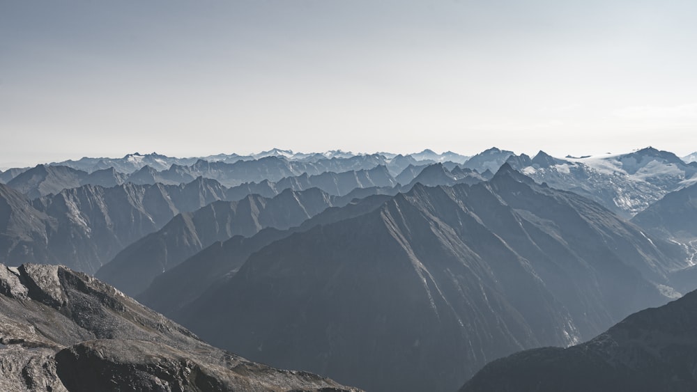 a view of a mountain range from the top of a mountain